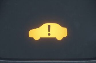 Жёлтый значок автомобиля с восклицательным знаком на приборной панели